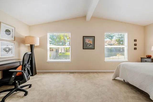 a bedroom with furniture and a window