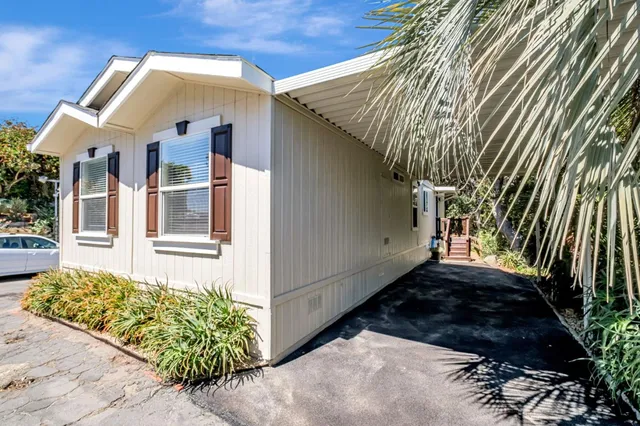 a view of a two chairs in the patio