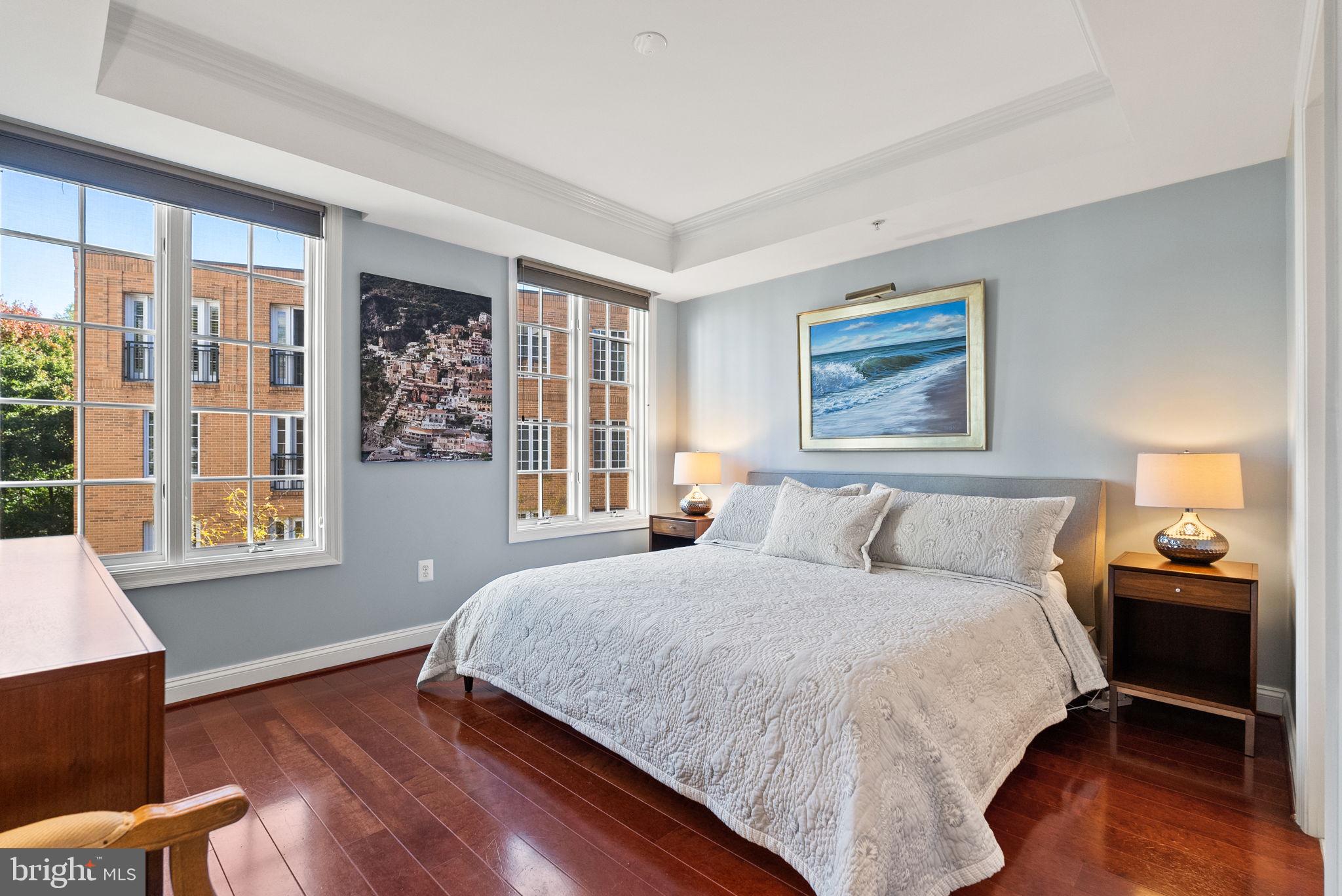 2501 Wisconsin Avenue Northwest, Unit 302 Washington, DC 20007 - Photo 18 of 33 a bedroom with a large bed and a window