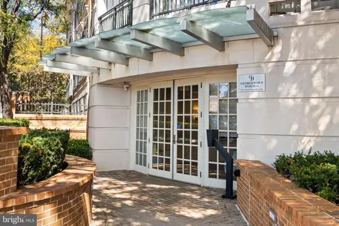 a view of a blue house with a large windows