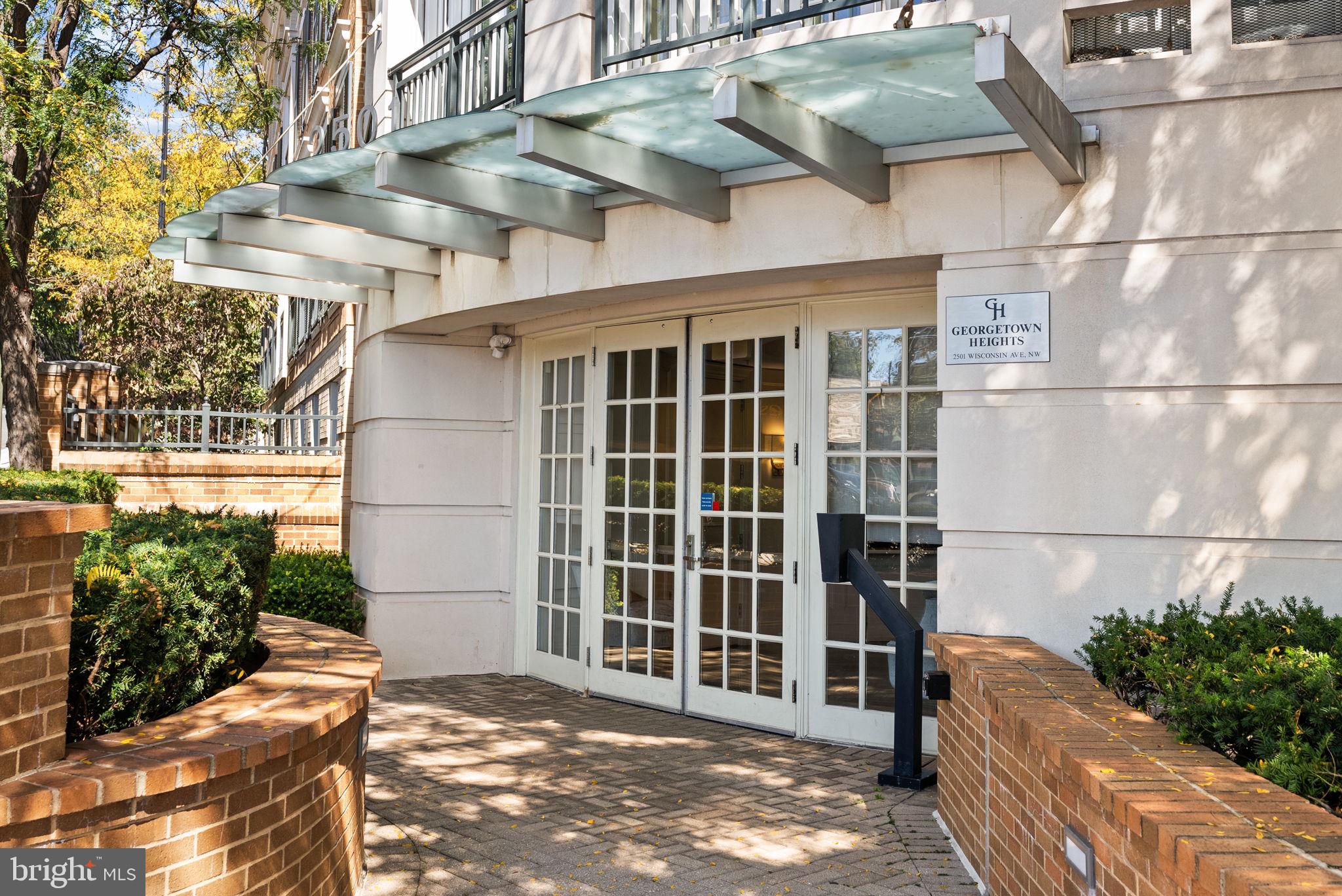 2501 Wisconsin Avenue Northwest, Unit 302 Washington, DC 20007 - Photo 2 of 33 a view of a blue house with a large windows