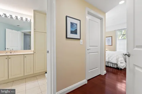 a view of a bedroom with wooden floor
