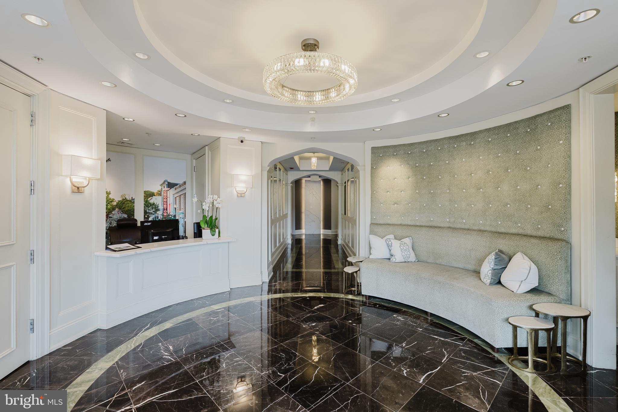 2501 Wisconsin Avenue Northwest, Unit 302 Washington, DC 20007 - Photo 3 of 33 a bedroom with bed and a chandelier