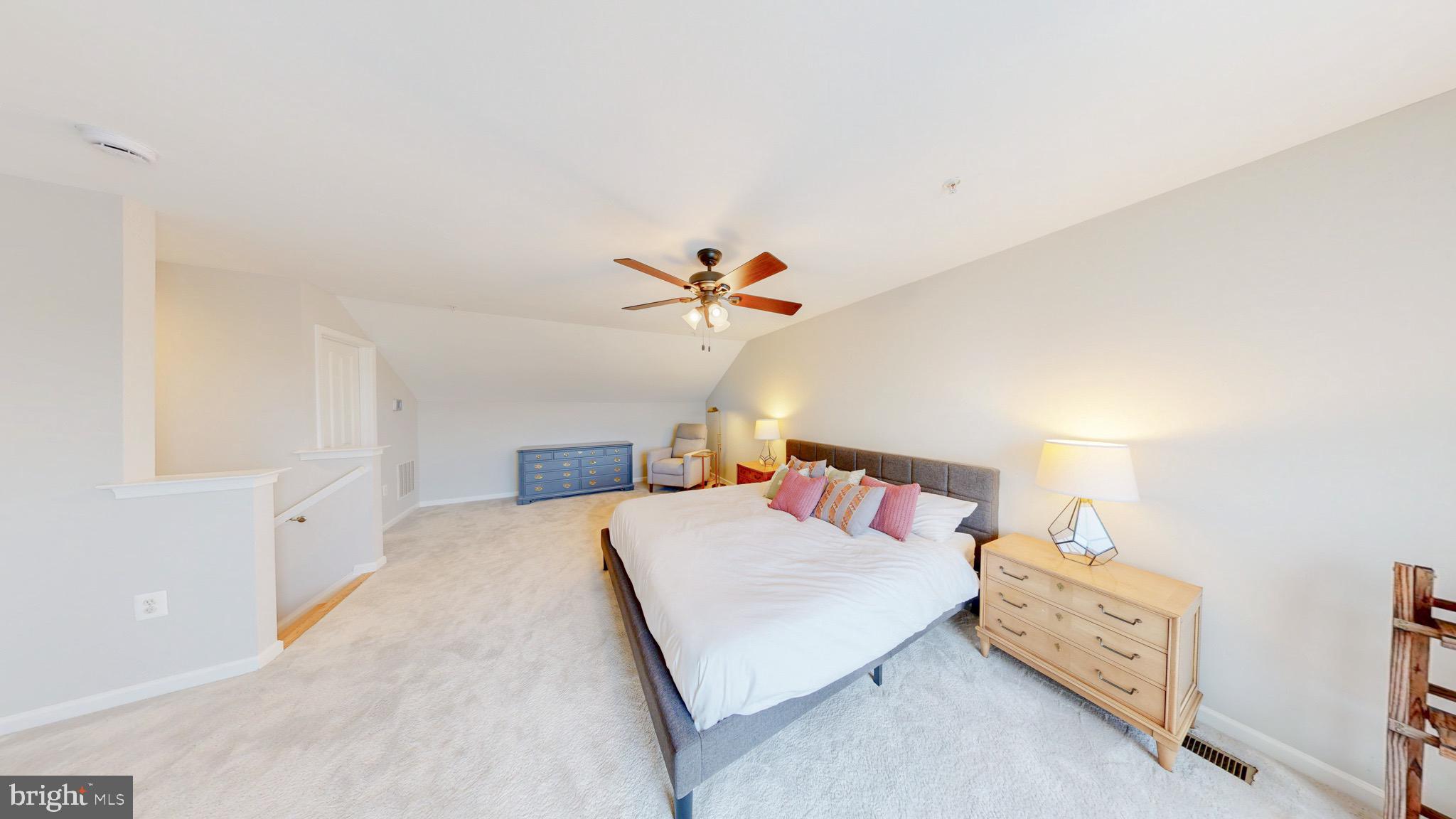 13227 Deer Highlands Way Silver Spring, MD 20906 - Photo 13 of 20 a bedroom with a bed and a chandelier