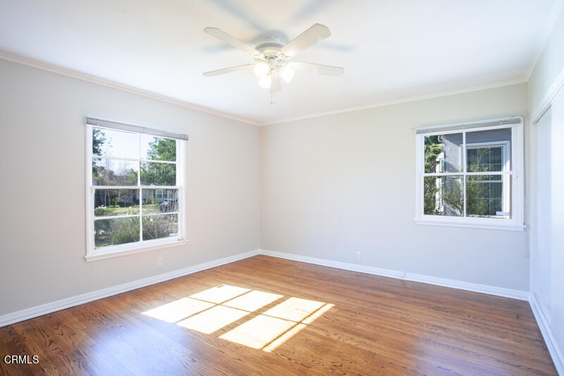 2345 Lambert Drive Pasadena, CA 91107 - Photo 12 of 25 a view of an empty room with wooden floor and a window