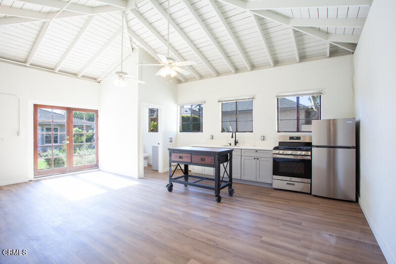 2345 Lambert Drive Pasadena, CA 91107 - Photo 19 of 25 a living room with furniture a fireplace and a table
