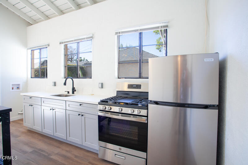 2345 Lambert Drive Pasadena, CA 91107 - Photo 20 of 25 a kitchen with granite countertop a refrigerator stove and sink