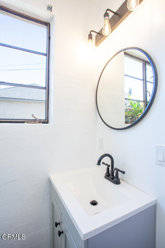 2345 Lambert Drive Pasadena, CA 91107 - Photo 22 of 25 a bathroom with a sink and a mirror