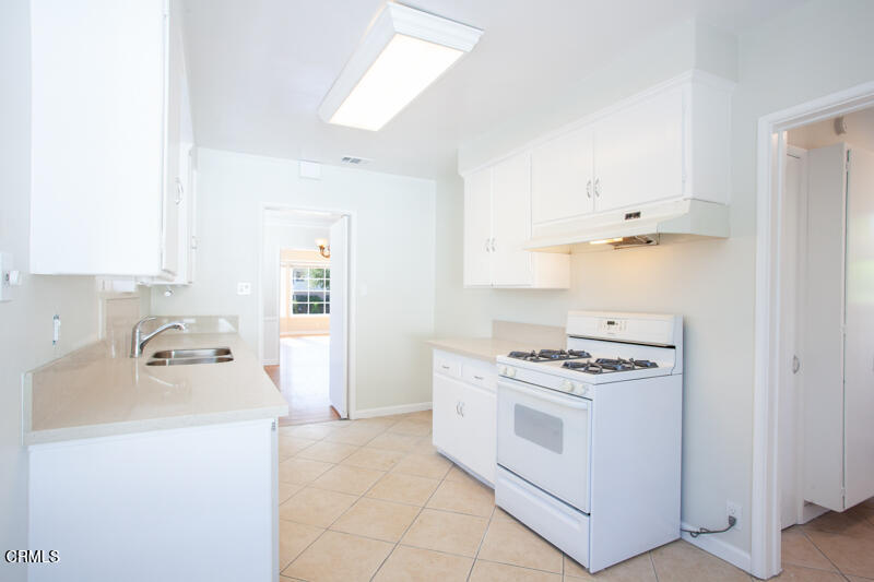 2345 Lambert Drive Pasadena, CA 91107 - Photo 6 of 25 a kitchen with a stove and a sink