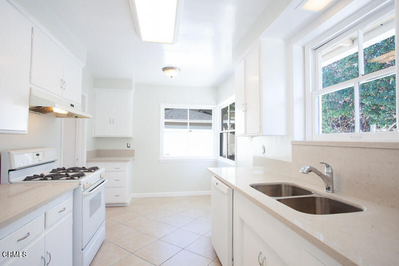 2345 Lambert Drive Pasadena, CA 91107 - Photo 7 of 25 a kitchen with a sink cabinets and window