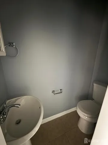 a bathroom with a toilet and a sink