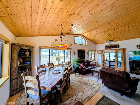 a living room with furniture and a book shelf