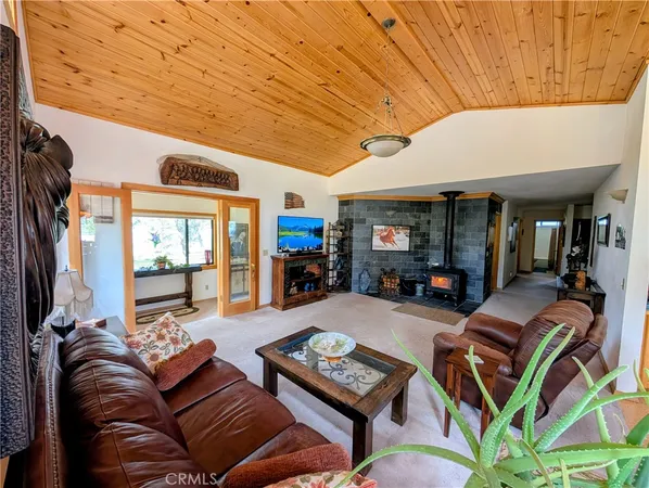 a bathroom with a granite countertop sink a large mirror and vanity