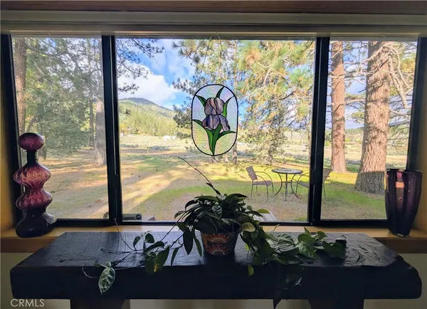 a bathroom with bathtub and window