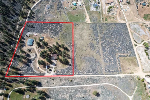 an outdoor view of patio with chairs and tables