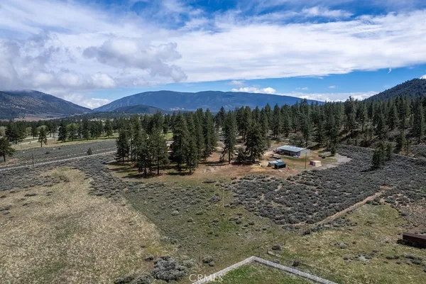 a view of a livingroom with wooden floor