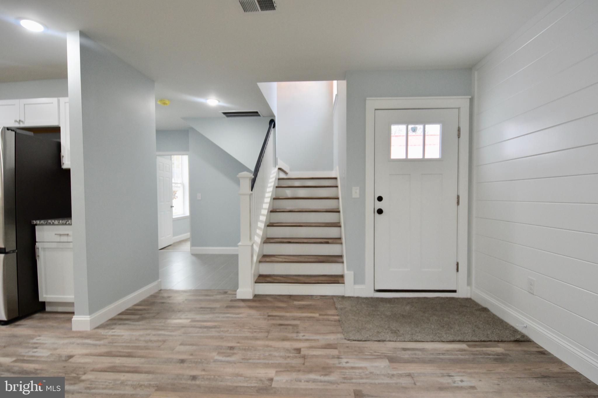 611 Main Street Sharptown, MD 21861 - Photo 2 of 37 a view of entryway and hall with wooden floor