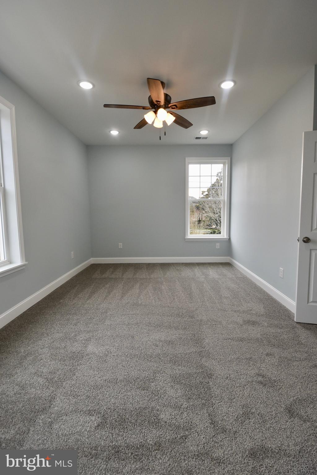 611 Main Street Sharptown, MD 21861 - Photo 30 of 37 an empty room with windows and fan