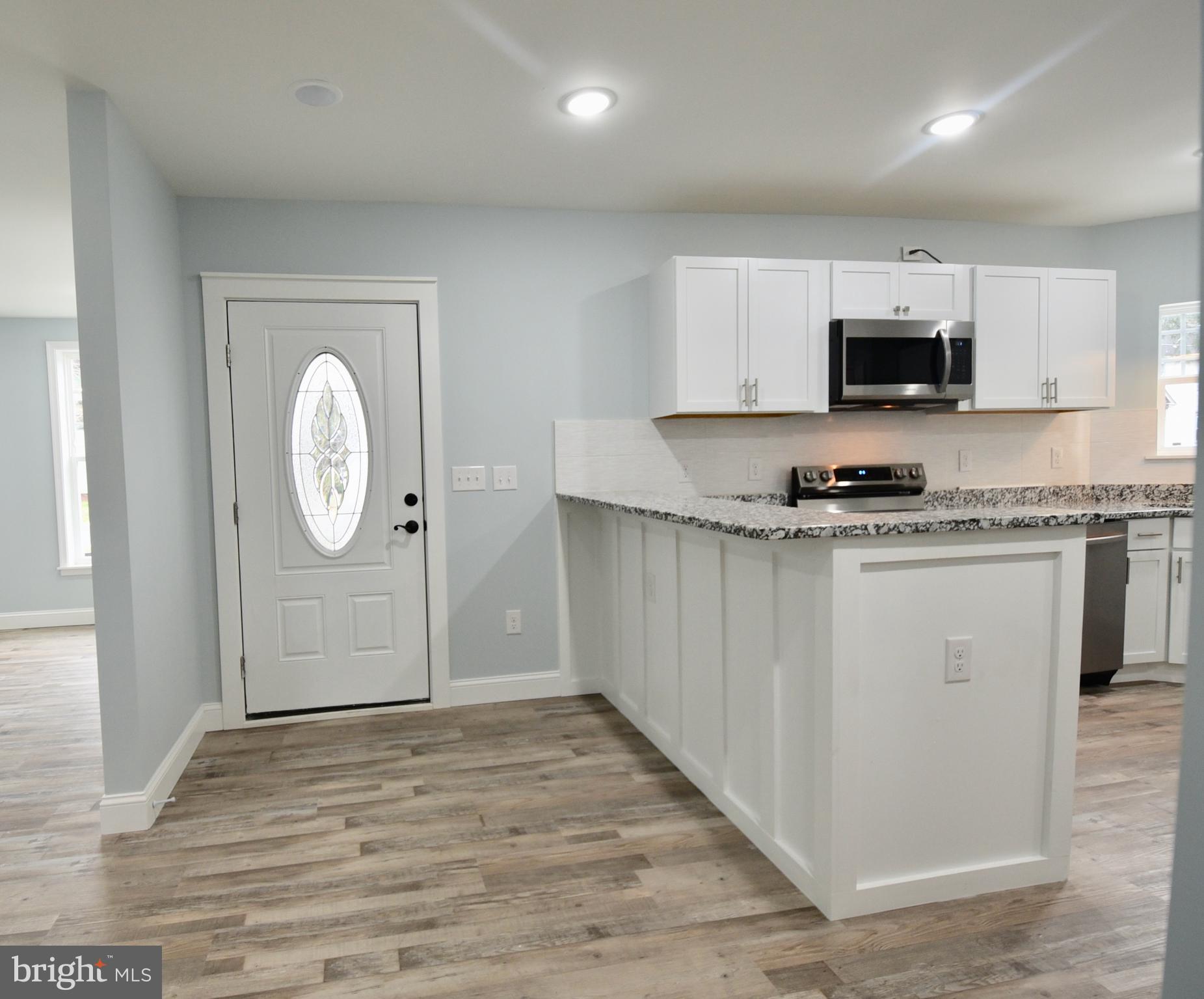 611 Main Street Sharptown, MD 21861 - Photo 7 of 37 a view of a kitchen with electric appliances