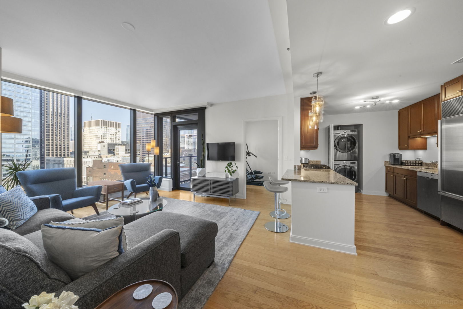 60 East Monroe Street, Unit 2606 Chicago, IL 60603 - Photo 12 of 34 a living room with fireplace furniture and a large window