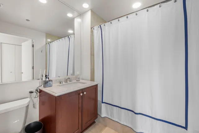 a bathroom with a double vanity sink and mirror