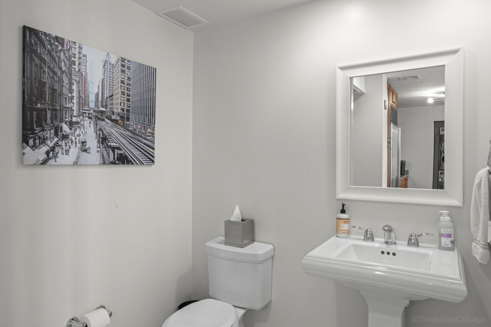 60 East Monroe Street, Unit 2606 Chicago, IL 60603 - Photo 23 of 34 a bathroom with a sink mirror and toilet