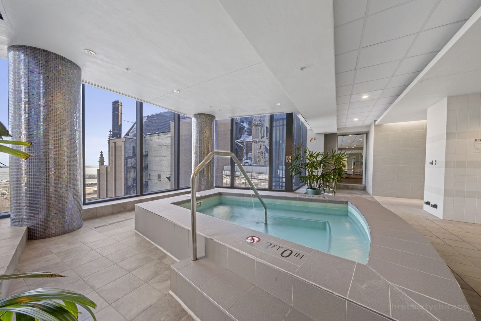 60 East Monroe Street, Unit 2606 Chicago, IL 60603 - Photo 32 of 34 a spacious bathroom with a tub and shower