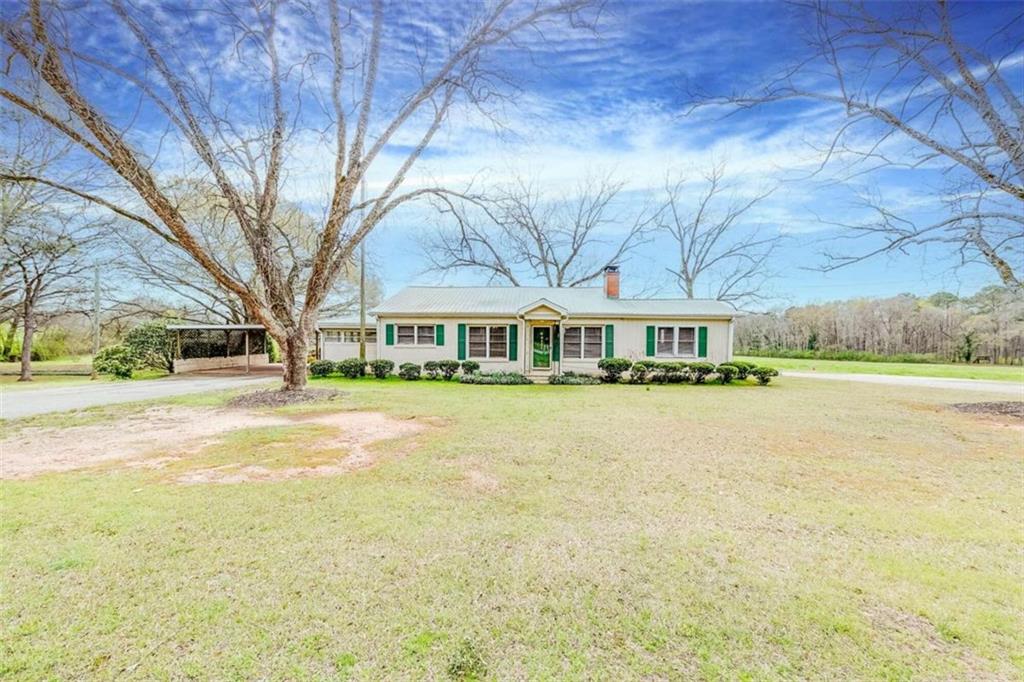 3052 Commerce Road Jefferson, GA 30549 - Photo 1 of 1 a view of house with outdoor space and sitting area