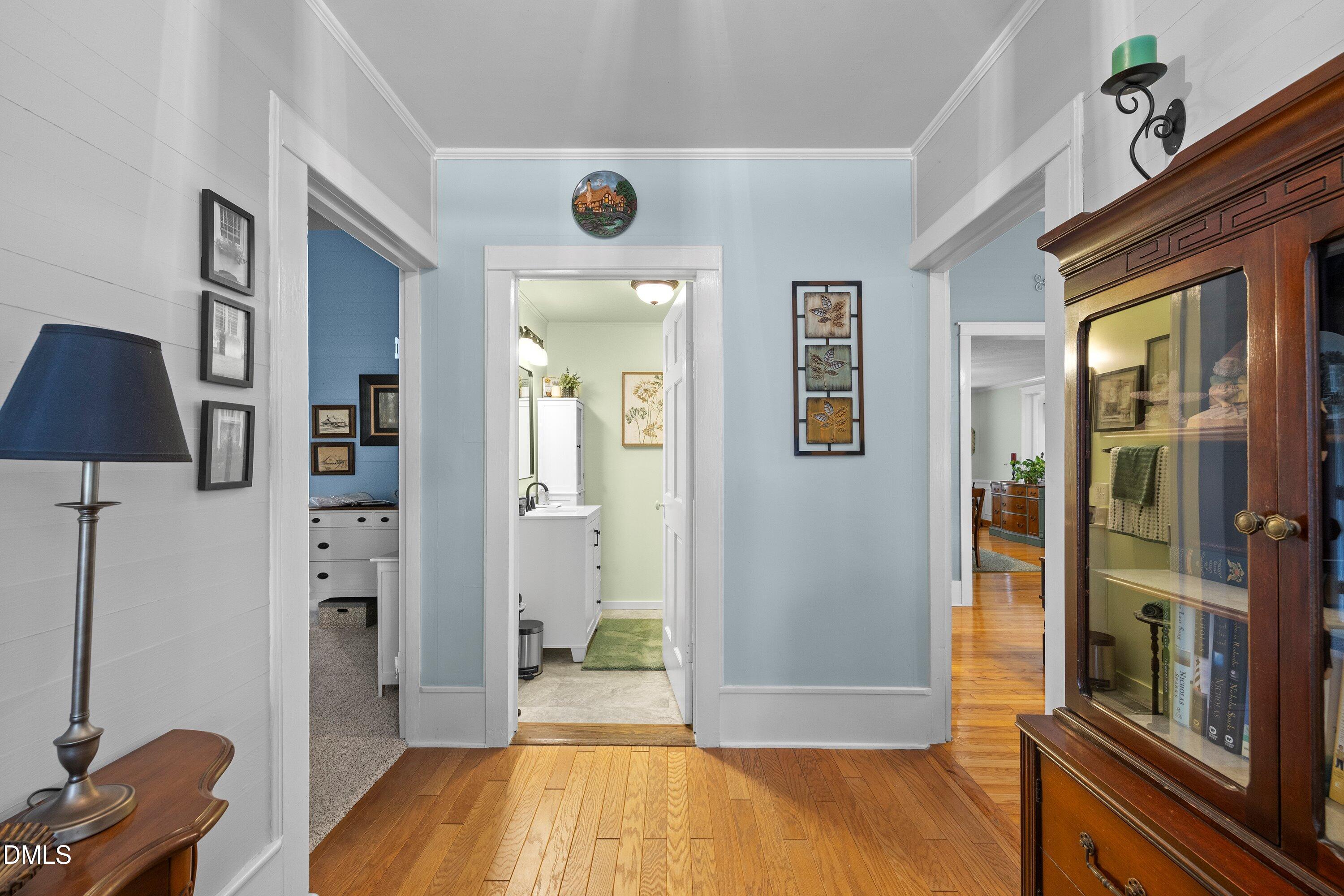 89 Bailey-Boykin Road Selma, NC 27576 - Photo 14 of 48 a view of a hallway with bathroom and wooden floor