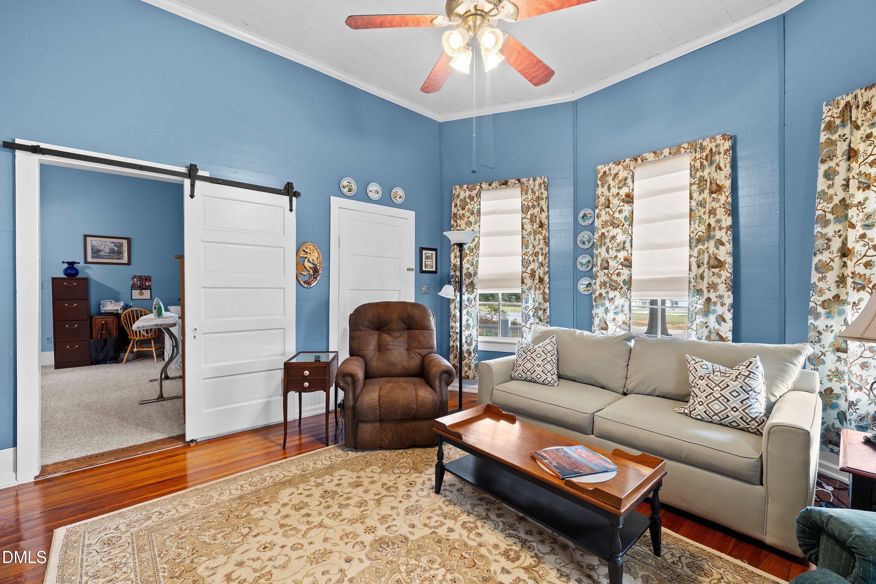 89 Bailey-Boykin Road Selma, NC 27576 - Photo 16 of 48 a living room with furniture and a large window