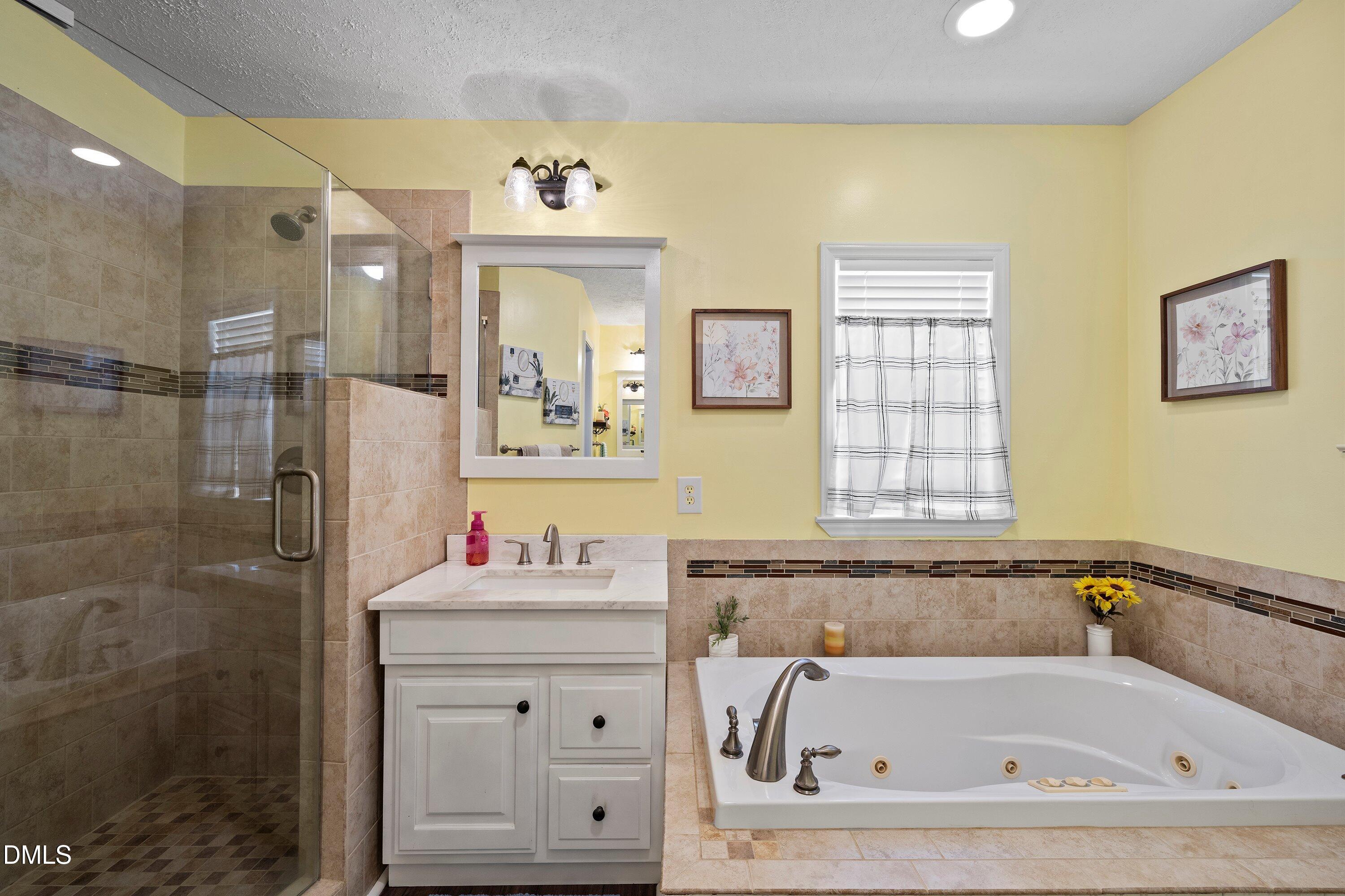 89 Bailey-Boykin Road Selma, NC 27576 - Photo 19 of 48 a bathroom with a bathtub sink and mirror