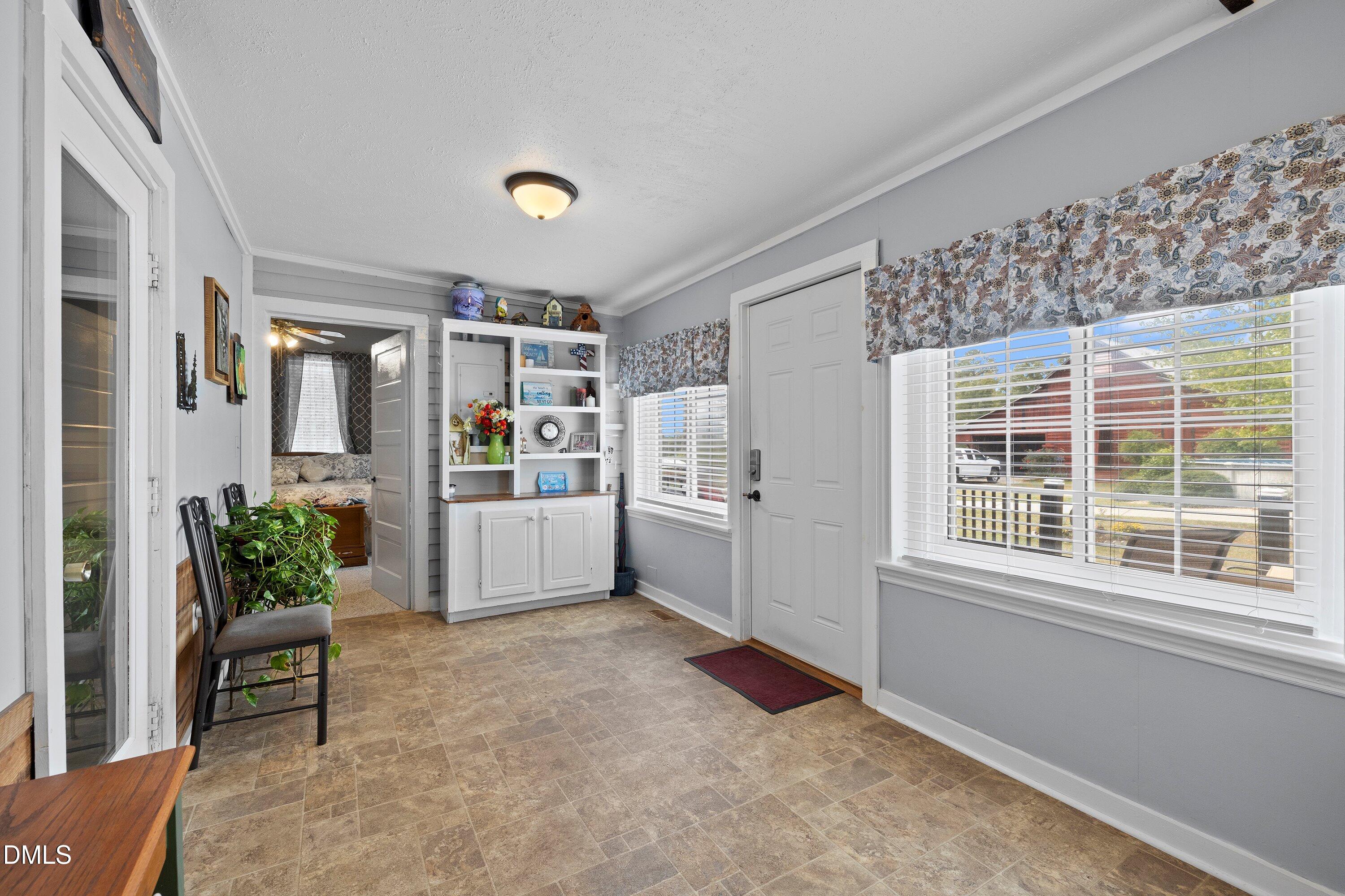 89 Bailey-Boykin Road Selma, NC 27576 - Photo 23 of 48 a living room with furniture and potted plant