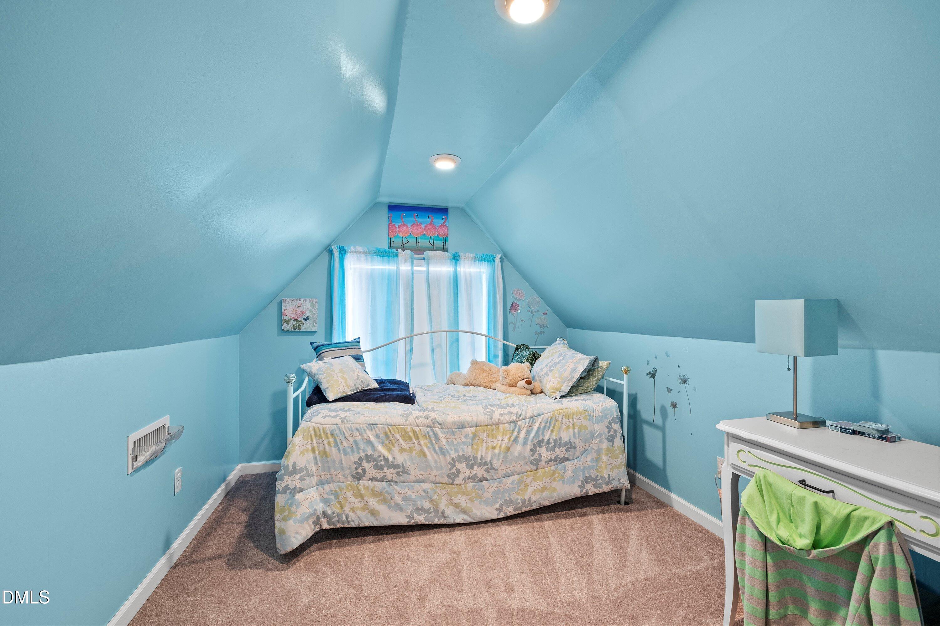 89 Bailey-Boykin Road Selma, NC 27576 - Photo 30 of 48 a bedroom with a bed and a chair