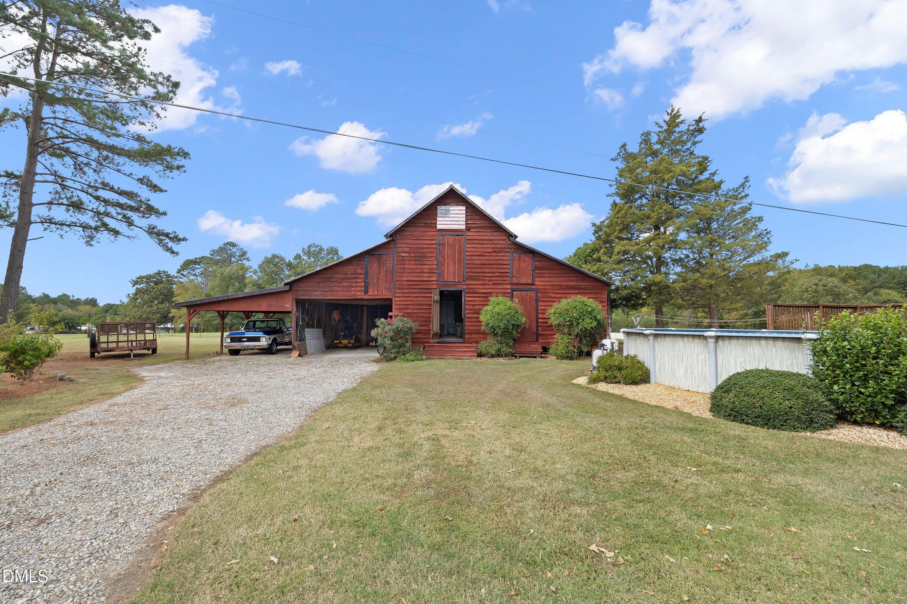 89 Bailey-Boykin Road Selma, NC 27576 - Photo 34 of 48 a front view of a house with a yard and garage