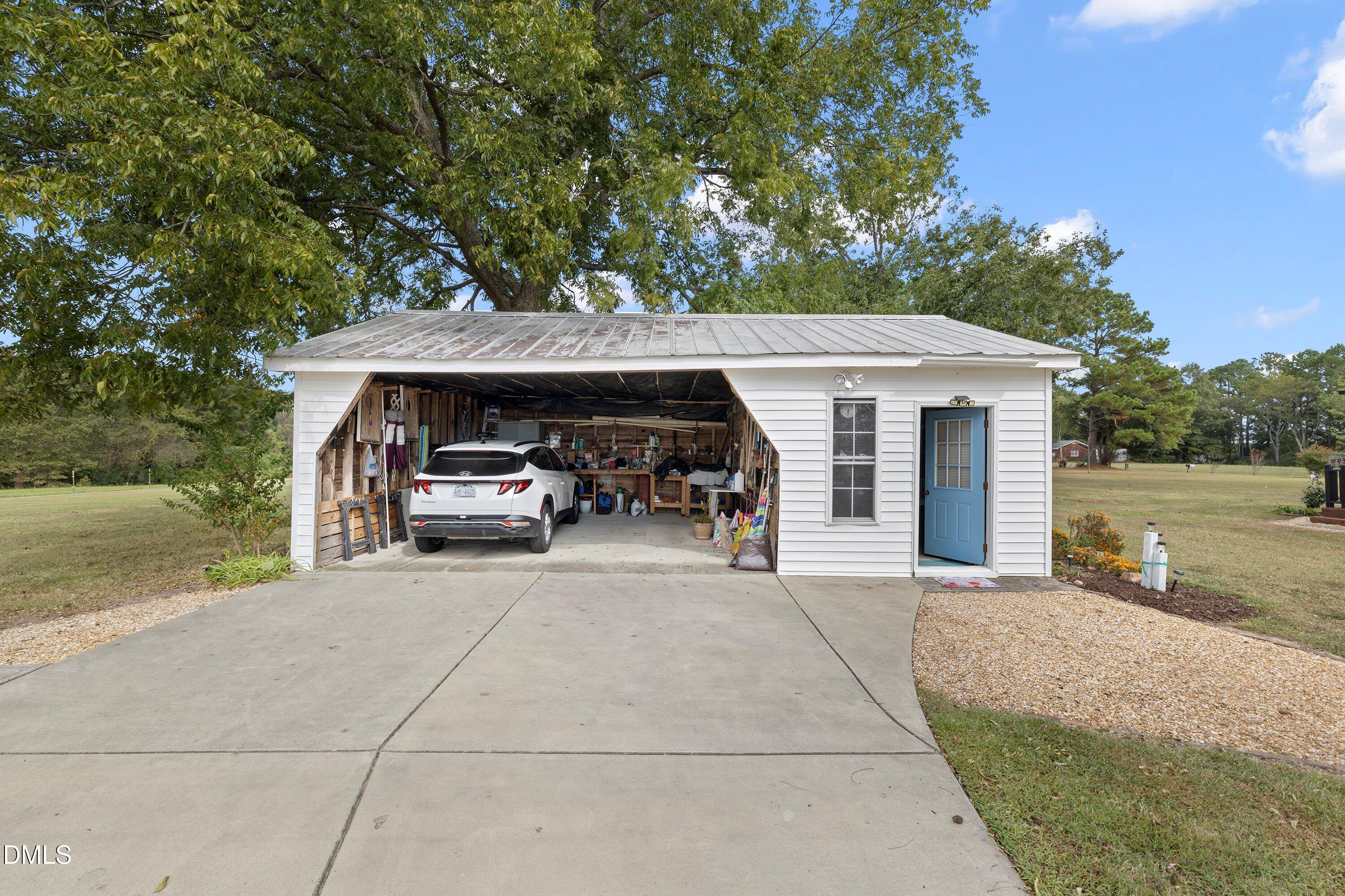 89 Bailey-Boykin Road Selma, NC 27576 - Photo 35 of 48 a car parked in front of house with a yard