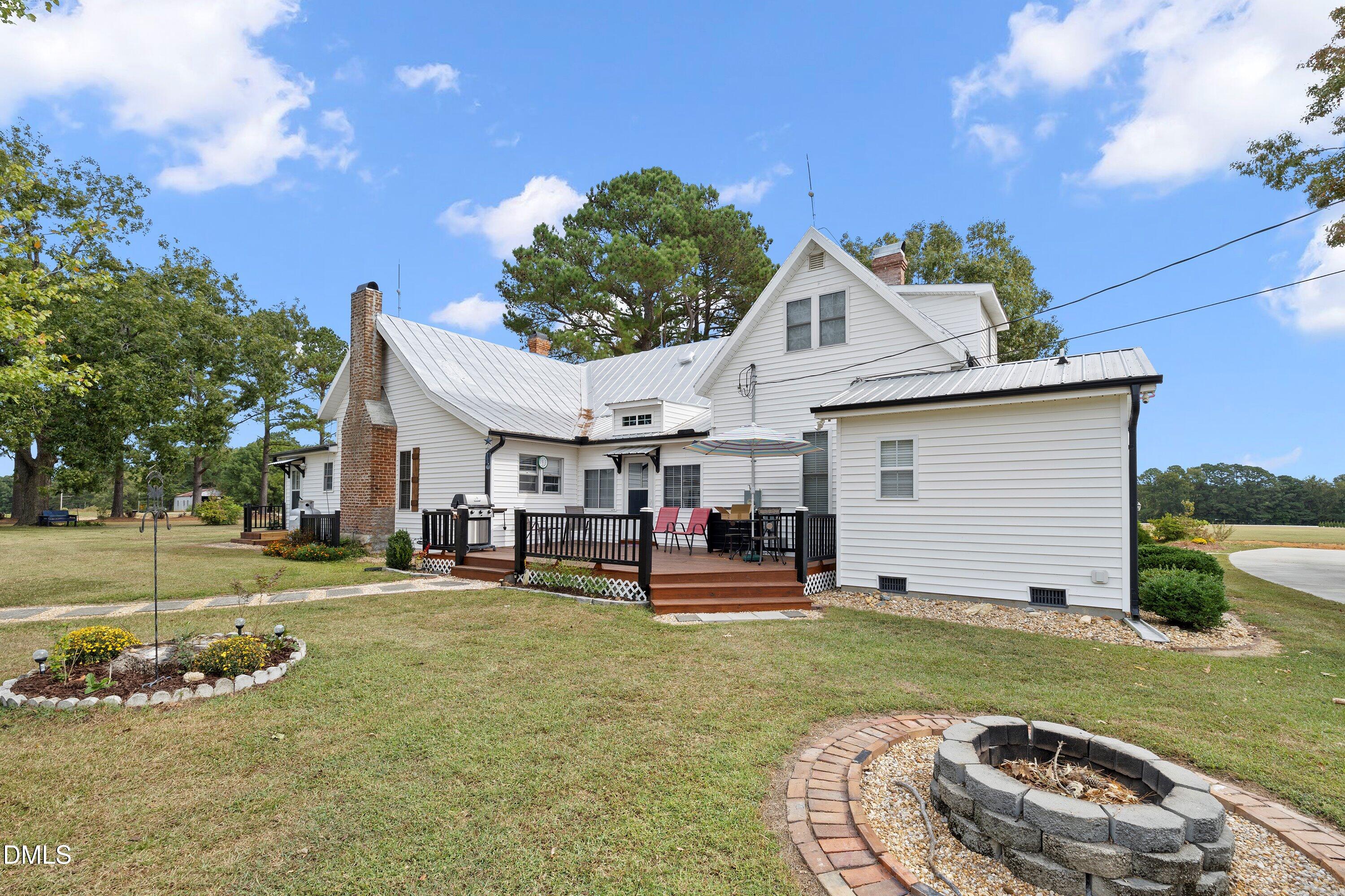 89 Bailey-Boykin Road Selma, NC 27576 - Photo 37 of 48 a view of a house with backyard and sitting area