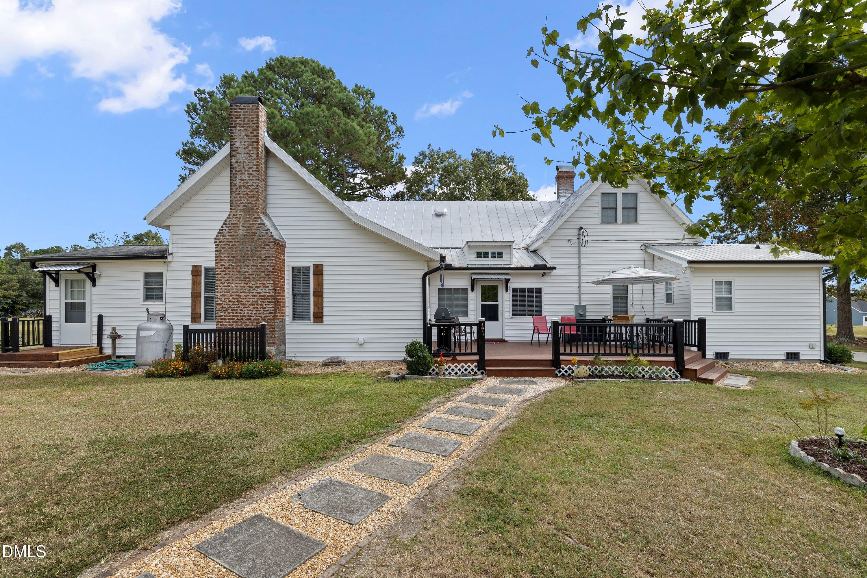 89 Bailey-Boykin Road Selma, NC 27576 - Photo 38 of 48 a view of a house with a yard and sitting area