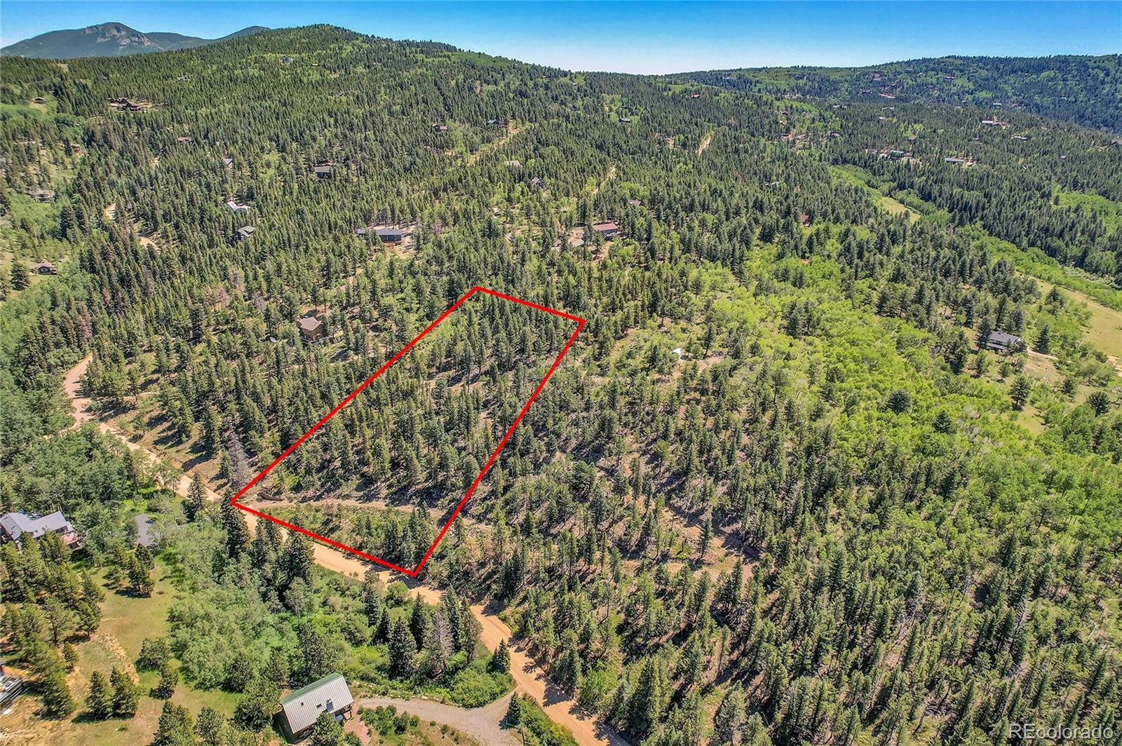 5 Hughesville Road Black Hawk, CO 80422 - Photo 14 of 17 a view of a forest with a mountain