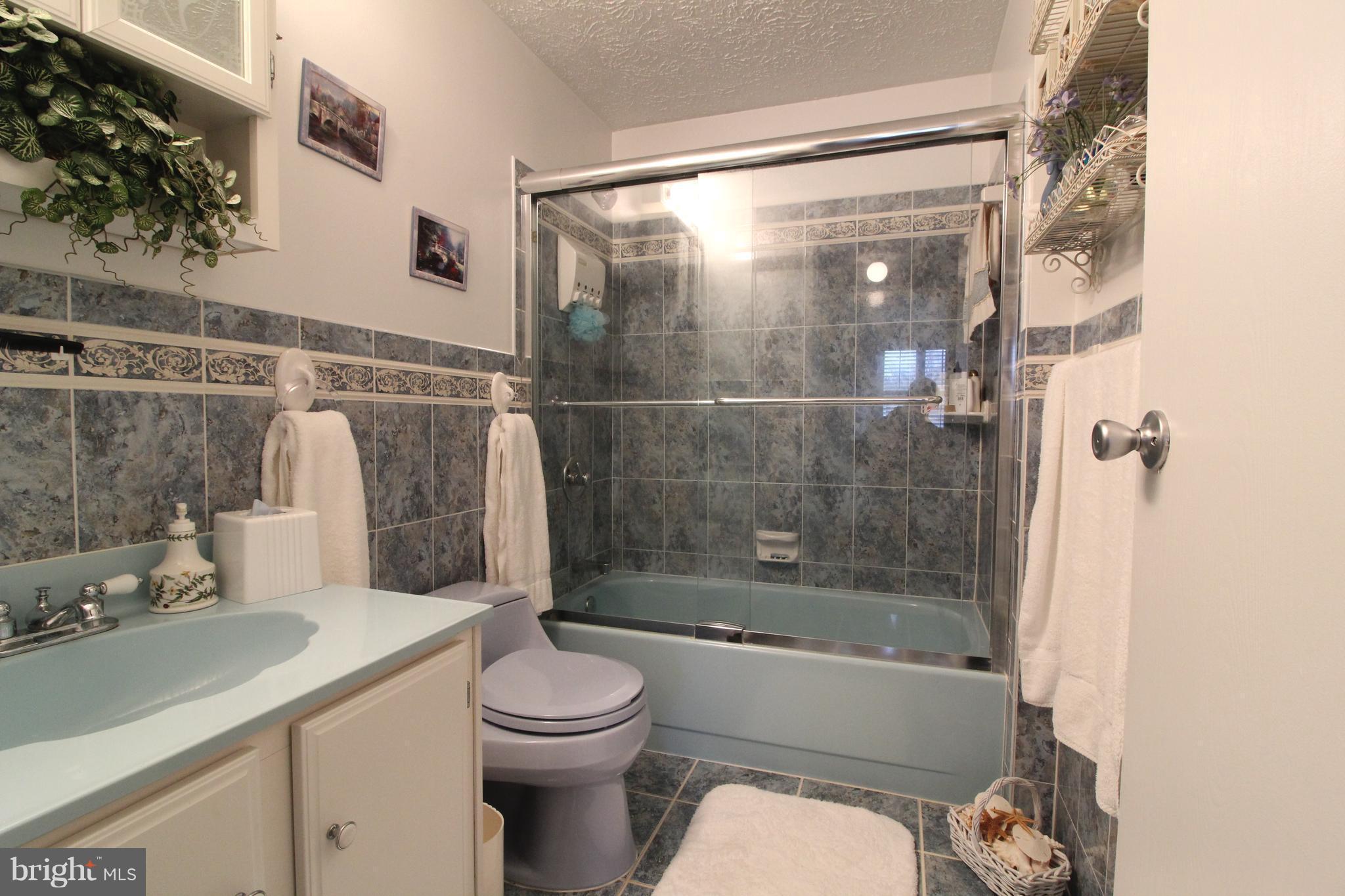 3 Old Maple Court Baltimore, MD 21221 - Photo 22 of 30 Custom Tile Hall Bath; Vanity with Custom Shelves