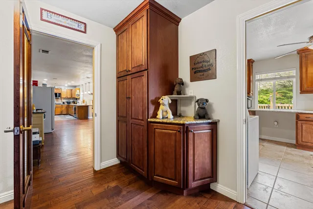 a kitchen with stainless steel appliances granite countertop a refrigerator and a sink