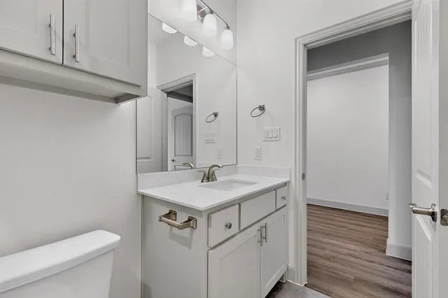 a bathroom with a sink a toilet and bathtub