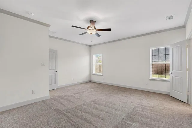 a bathroom with a sink double vanity granite tub and a mirror