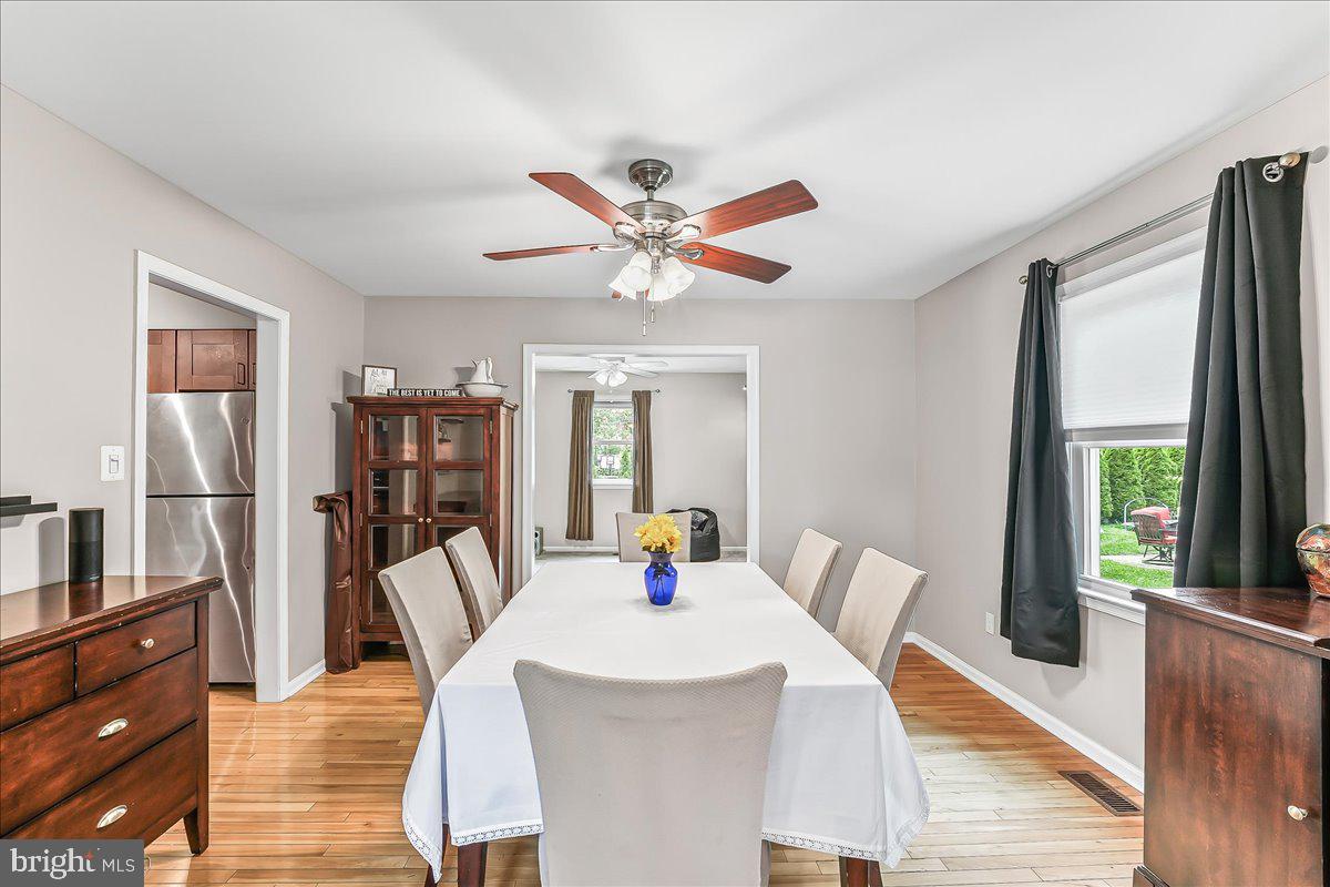 208 Rambling Way Springfield, PA 19064 - Photo 12 of 39 a view of a dining room with furniture window and wooden floor