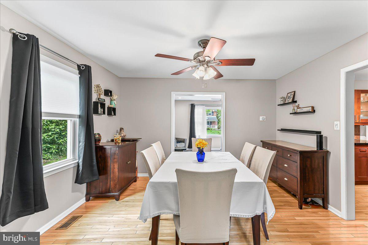 208 Rambling Way Springfield, PA 19064 - Photo 13 of 39 a view of a dining room with furniture window and wooden floor