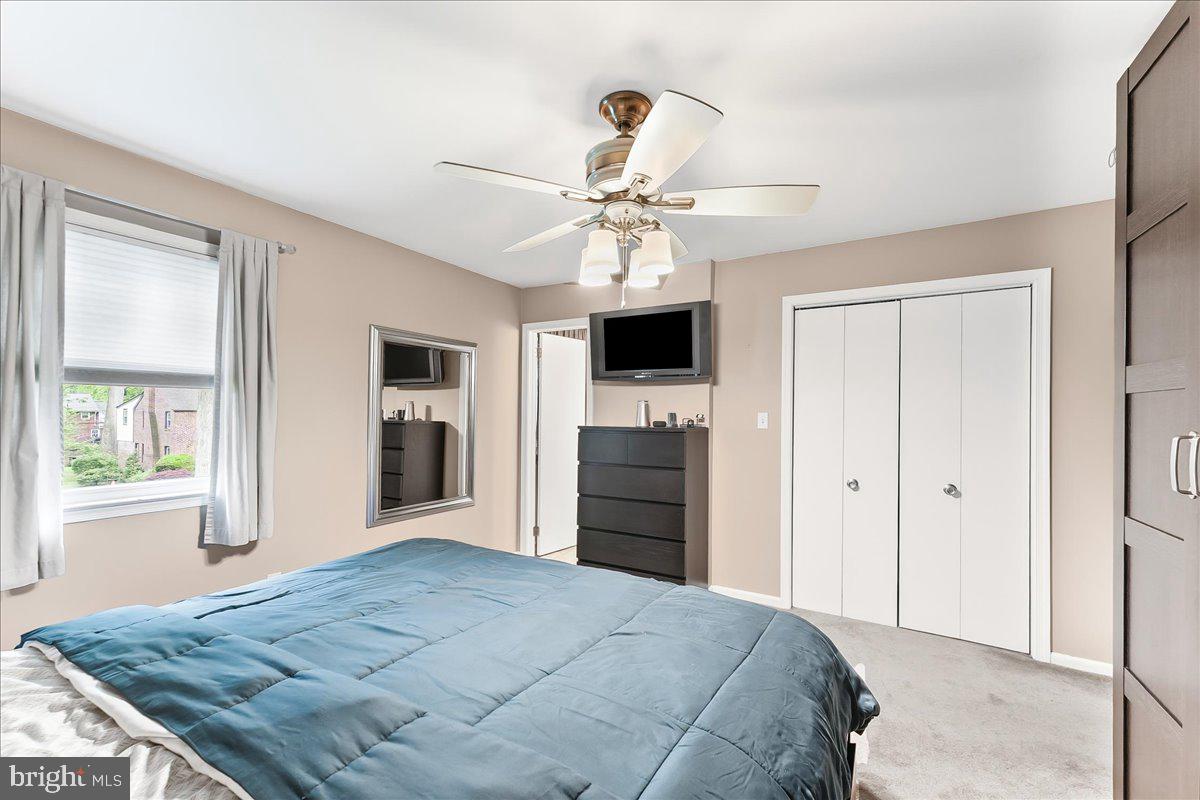 208 Rambling Way Springfield, PA 19064 - Photo 19 of 39 a bedroom with a bed and a chandelier