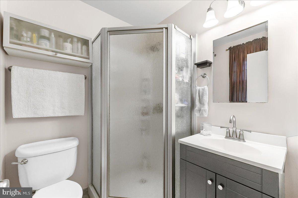 208 Rambling Way Springfield, PA 19064 - Photo 20 of 39 a bathroom with a toilet sink shower and mirror