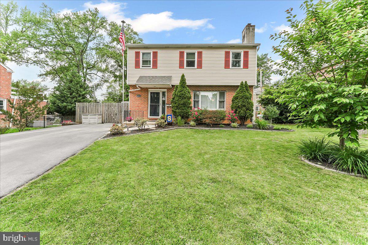 208 Rambling Way Springfield, PA 19064 - Photo 2 of 39 a front view of a house with a yard and trees
