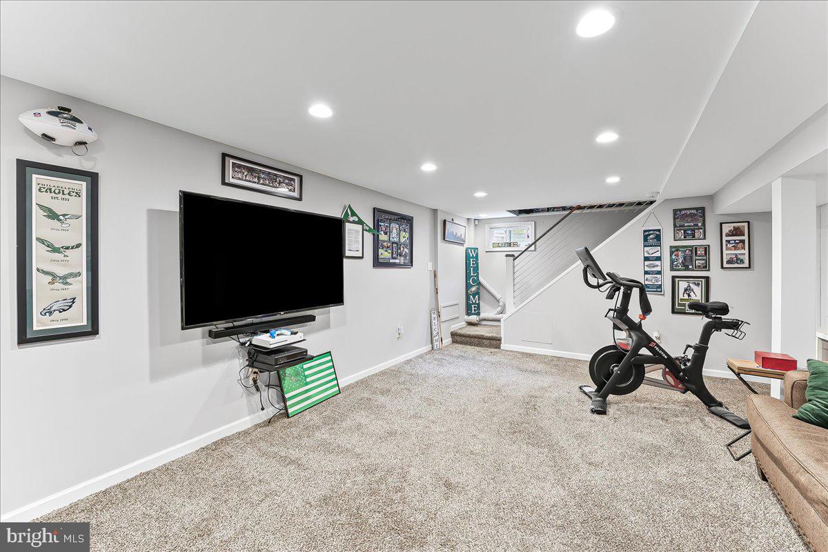 208 Rambling Way Springfield, PA 19064 - Photo 27 of 39 a living room with furniture and a flat screen tv