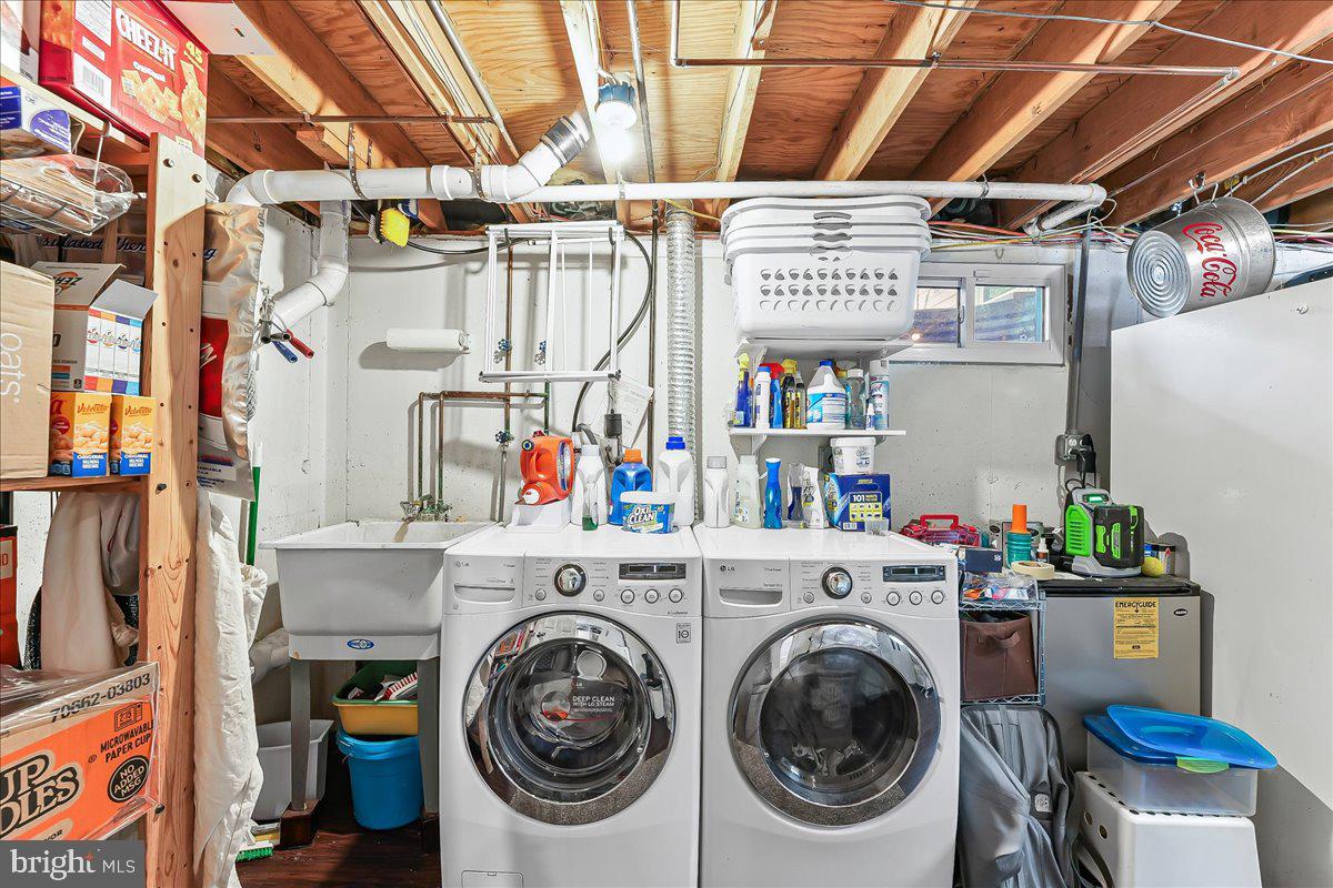 208 Rambling Way Springfield, PA 19064 - Photo 30 of 39 a utility room with dryer and washer