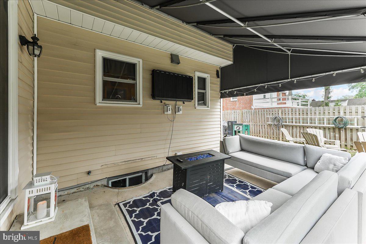 208 Rambling Way Springfield, PA 19064 - Photo 32 of 39 a view of a patio with couches chairs and wooden floor